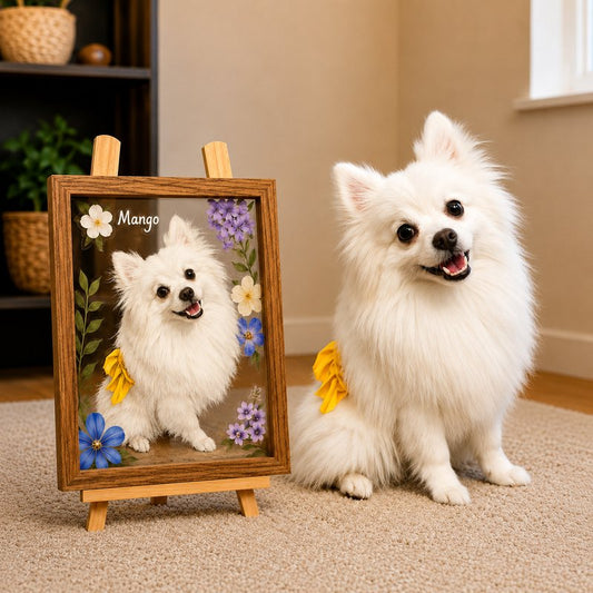White Pomeranian sitting beside a finished hand-painted glass pet portrait by PetPortraArt