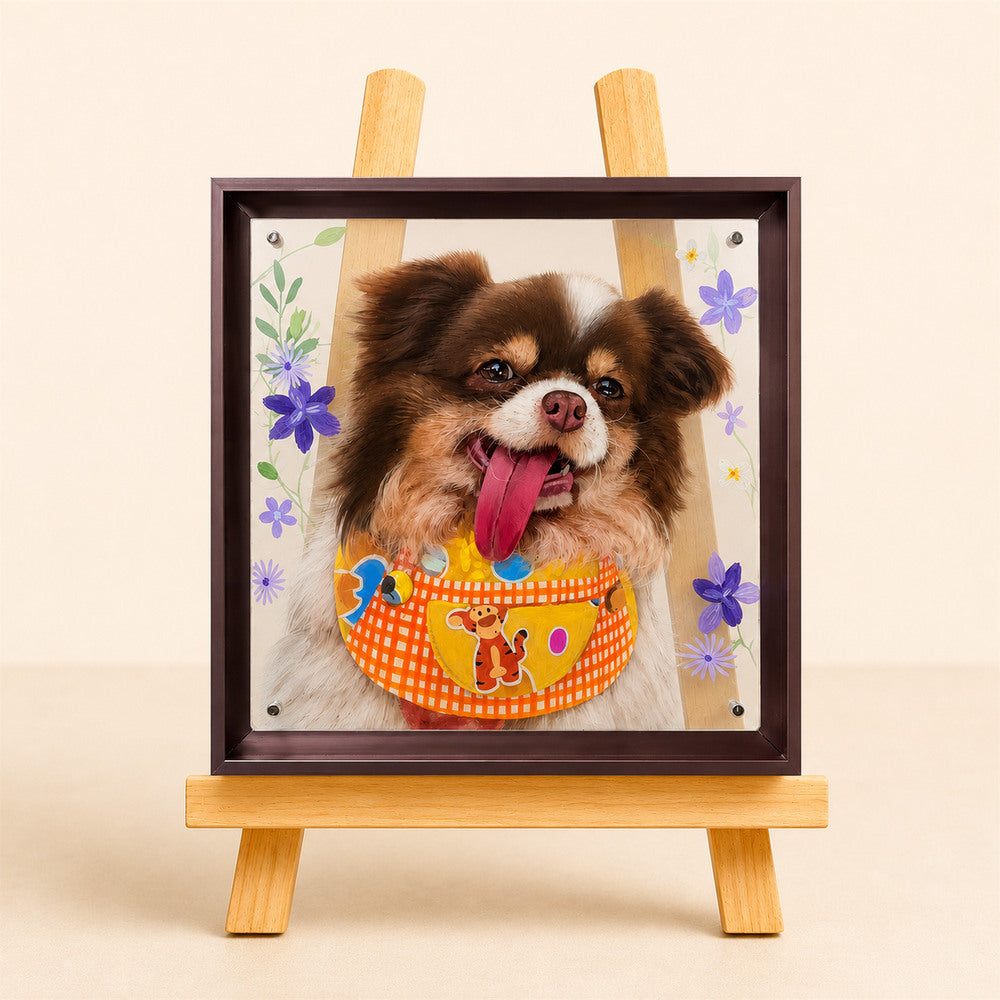 Custom framed glass portrait of a smiling brown-and-white dog with colorful floral details displayed on a wooden easel.