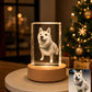 Custom square 3D dog portrait crystal night light on a wooden LED base, personalized from a pet photo and displayed beside a Christmas tree.