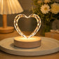Classic heart-shaped crystal pet portrait night light glowing on a wooden LED base in a warm home setting.