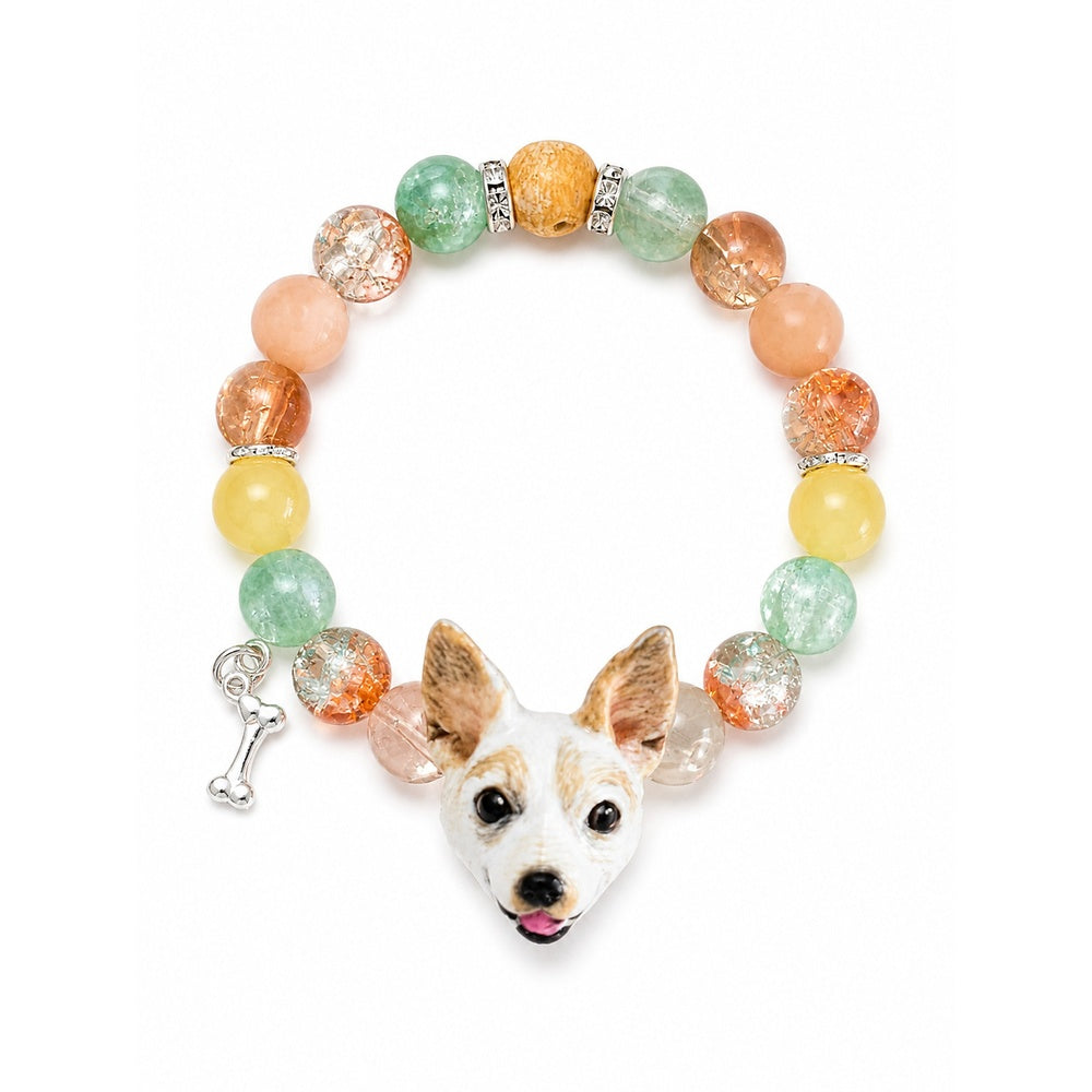 Custom white-and-tan small dog portrait bracelet with orange, green and yellow crystal beads on white.
