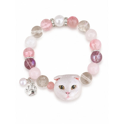 Custom white folded-ear cat portrait bracelet with pink, purple and clear crystal beads on white.