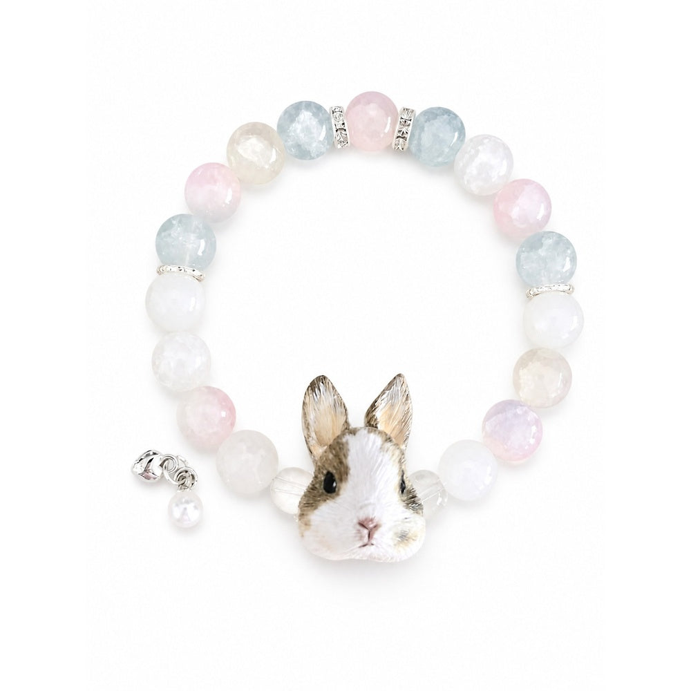 Custom brown-and-white rabbit portrait beaded bracelet with pastel pink and clear beads on white.