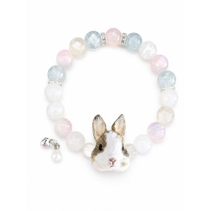 Custom brown-and-white rabbit portrait beaded bracelet with pastel pink and clear beads on white.