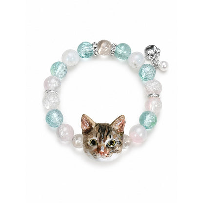 Custom tabby cat portrait beaded bracelet with aqua and clear crystal beads on white.
