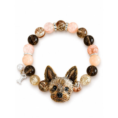 Custom Yorkshire terrier portrait bracelet with peach and smoky brown crystal beads on white.