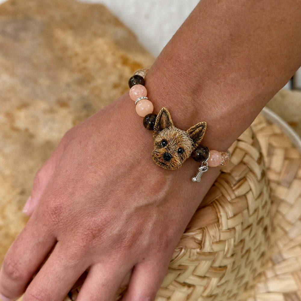 Personalized Yorkshire terrier portrait bracelet worn on the wrist with peach and brown crystal beads.