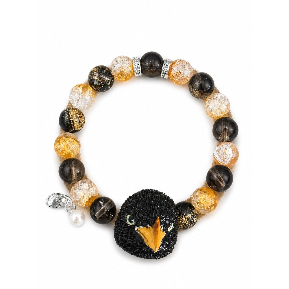 Handmade black pet bird portrait bracelet with black, amber and clear crystal beads on white.