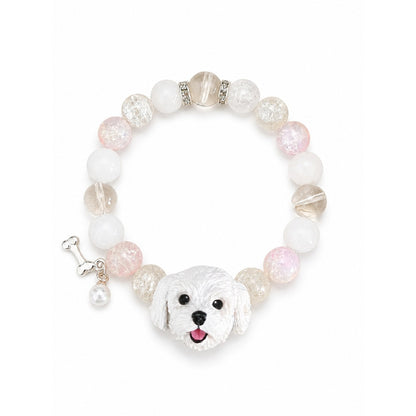 Handmade white fluffy dog portrait bracelet with pale pink and clear crystal beads on white.