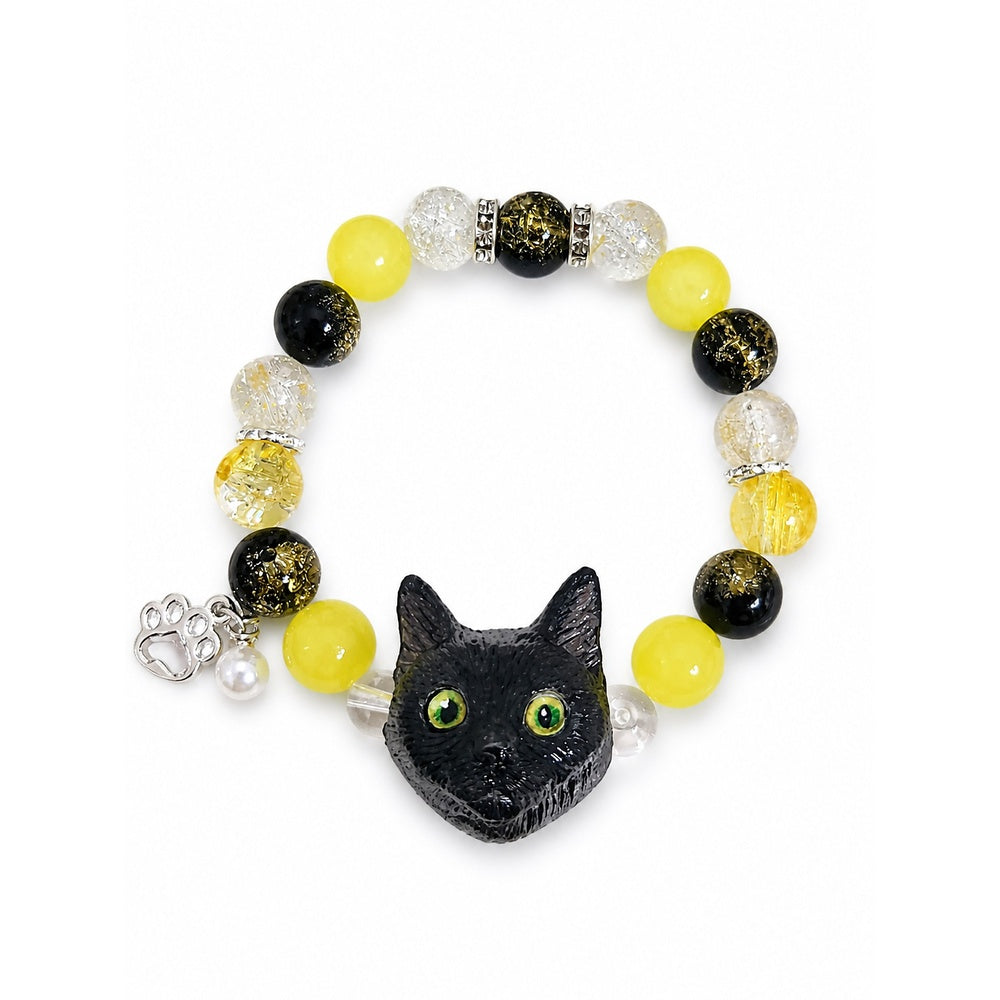 Custom black cat portrait beaded bracelet with bright yellow and black crystal beads on white.