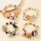 Collection of personalized pet portrait beaded bracelets featuring dog, cat and rabbit designs.
