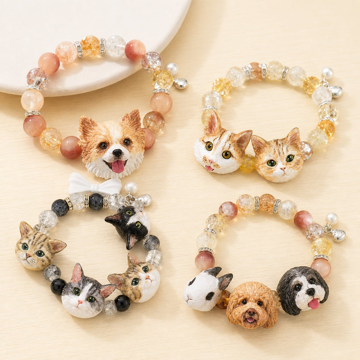Collection of handmade custom pet portrait beaded bracelets featuring dogs, cats and rabbits.