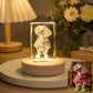 Personalized dog photo engraved inside a rectangular crystal night light on a warm wooden LED base, shown beside the original pet photo.