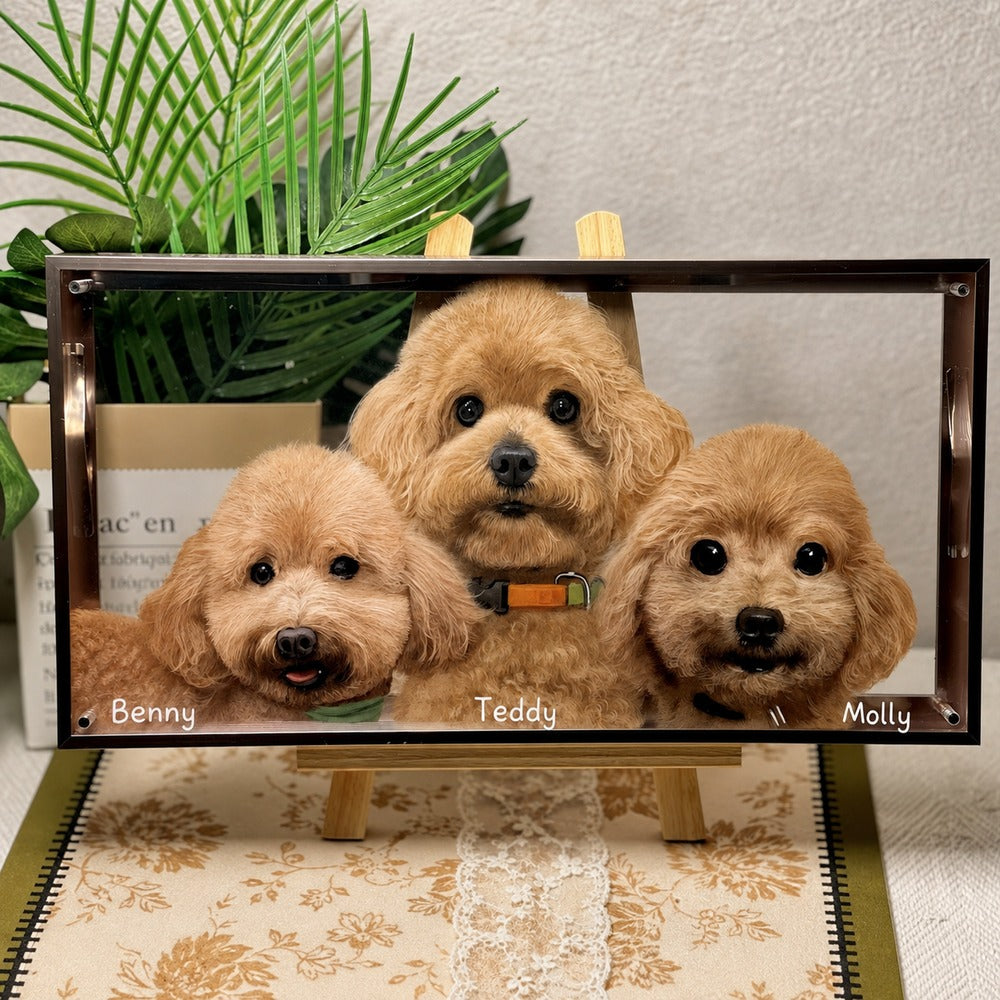 Custom glass pet portrait of Penny, Archie, and Nina, three dogs displayed together in a framed portrait