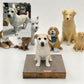 Custom cream-colored dog figurine displayed on a square base with the pet’s reference photo shown in the upper-left corner.