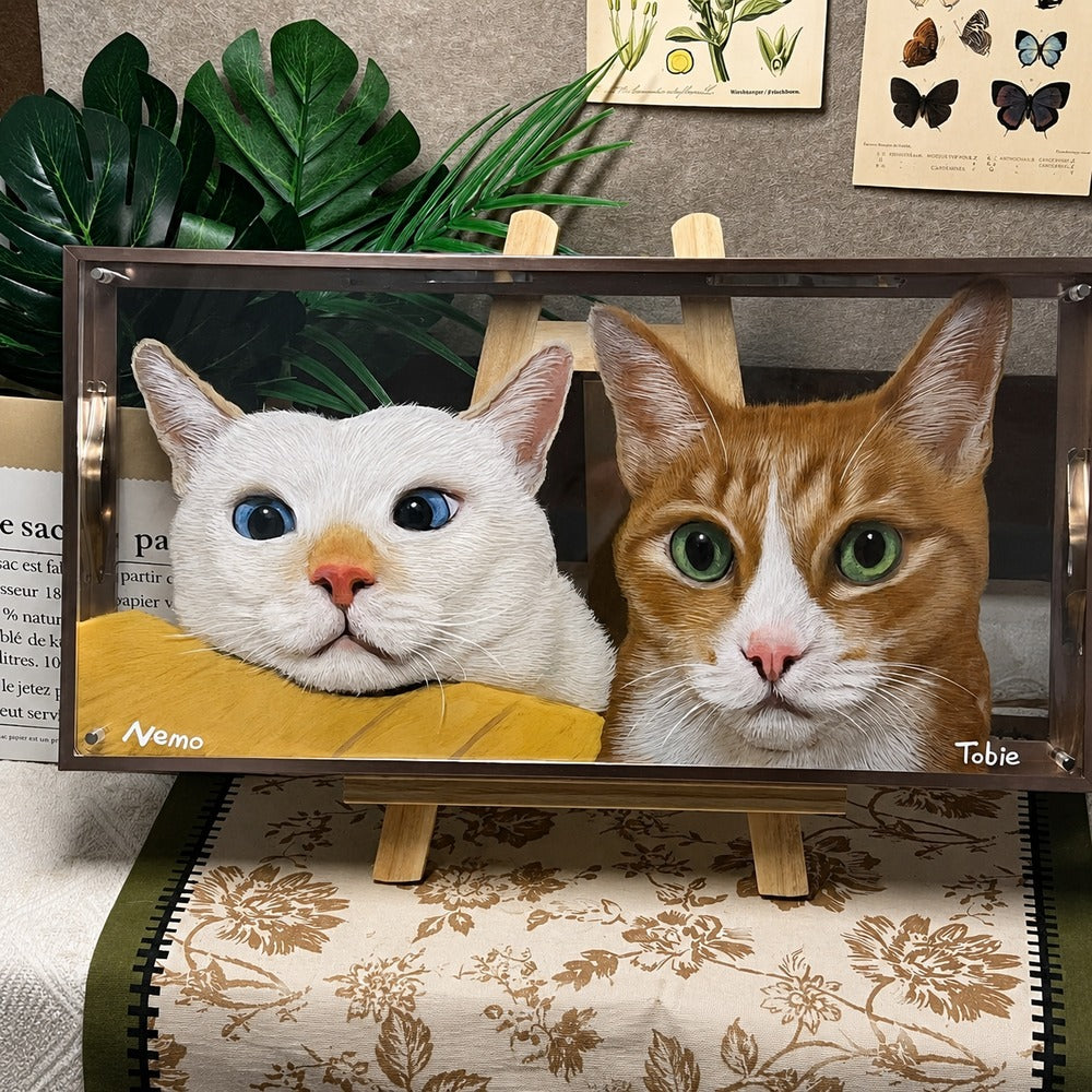 Personalized glass pet portrait of Nemo and Tobie, two cats displayed together in a framed portrait