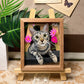 Custom glass pet portrait of a gray tabby cat named Miko surrounded by pink flowers and displayed in a wooden frame.